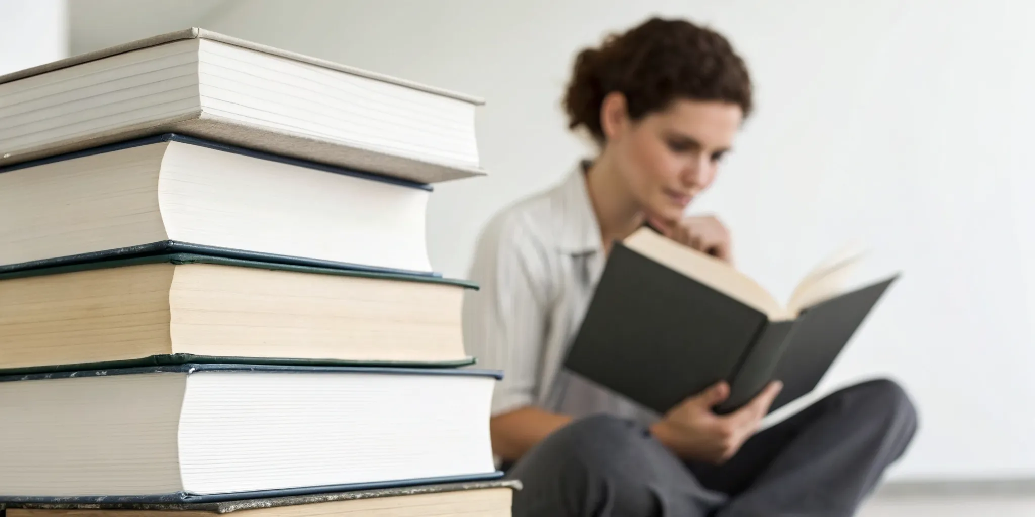 Reading Genius® 3.0 Blog 8 A woman reading a book, learning how to absorb and retain information.