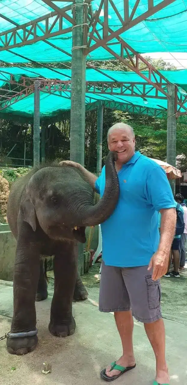 Ed's Biography v1 5 Ed with a baby elephant