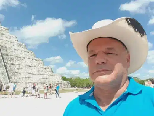 The Story of Ed v1 34 Ed Strachar outdoors in a white hat