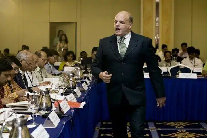 The Story of Ed v1 31 Ed Strachar leading a seminar for a room of professionals